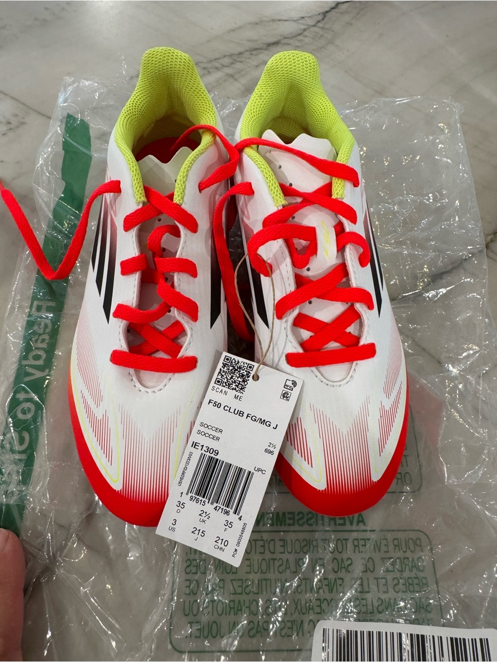 Kids Adidas F50 White and Neon Yellow Soccer Shoes with Red Accents